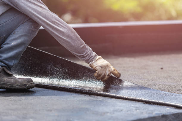 Professional Basement Waterproofing technician working in Carlisle, AR